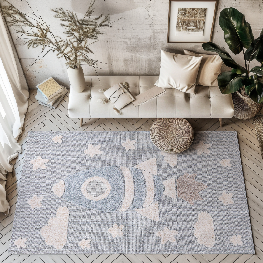 Soft kids rug with rocket and clouds for a playful bedroom or playroom.