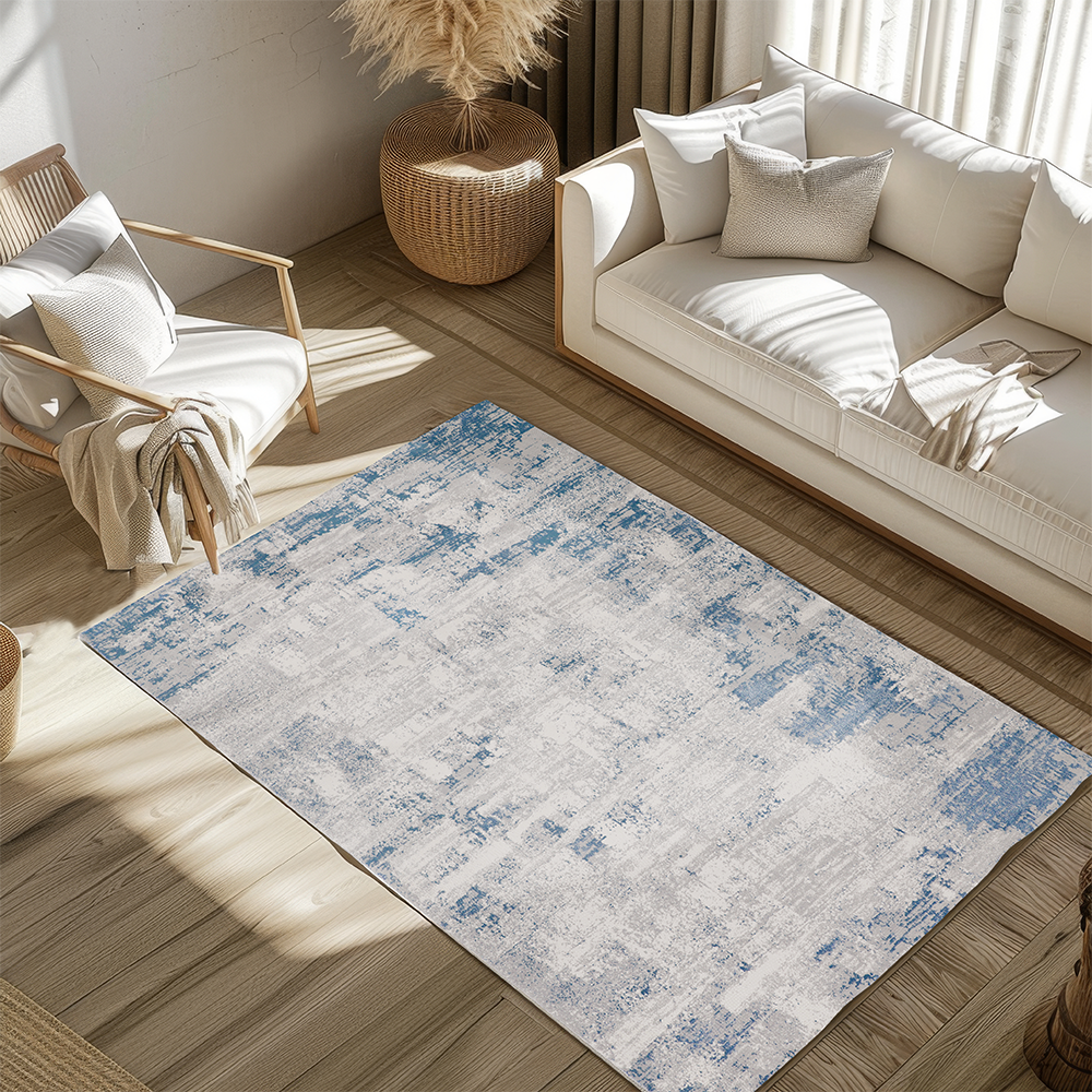 Blue and gray abstract textured rug enhancing a modern living room decor.