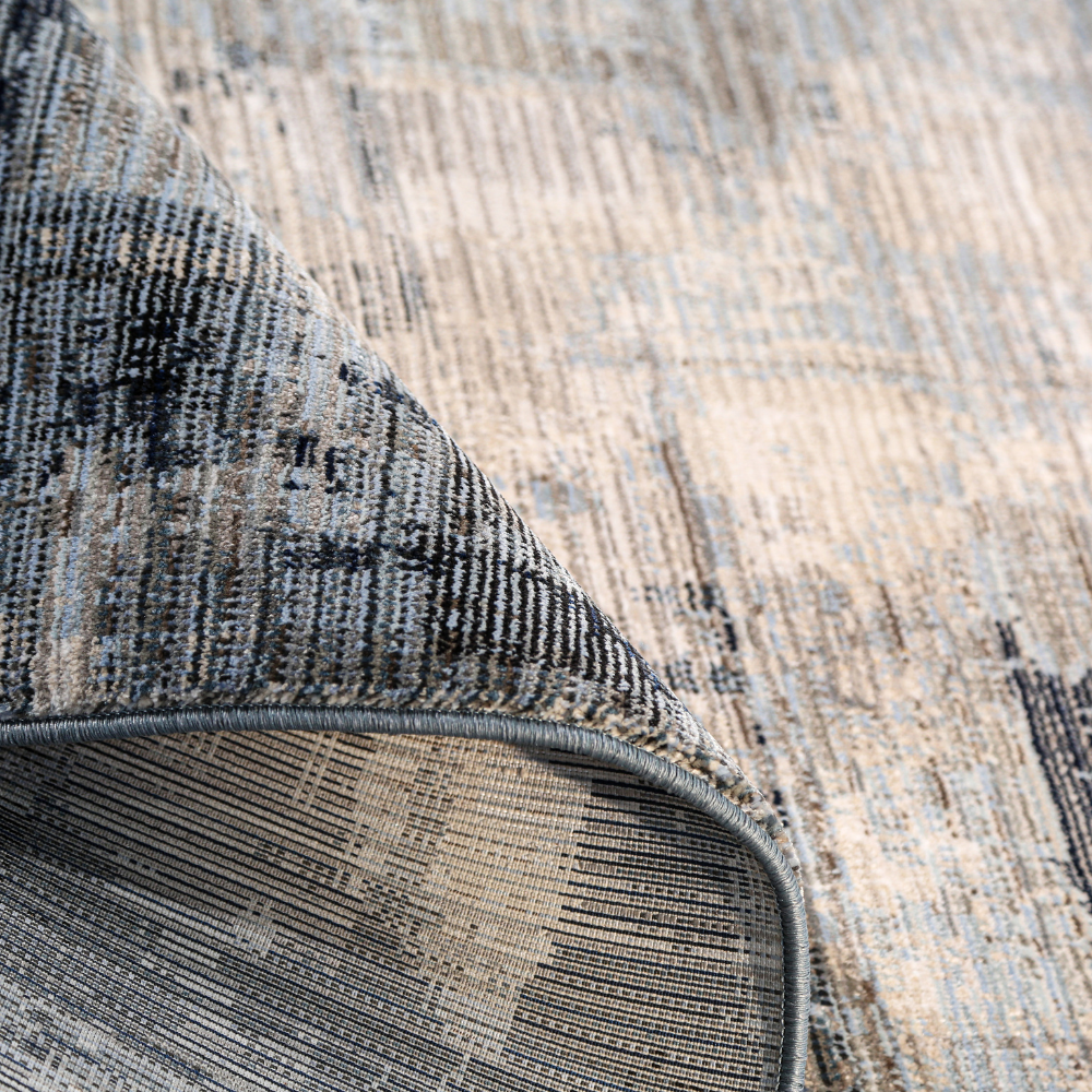 Sable Abstract Textured Rug in gray and cream, perfect for modern home styling.