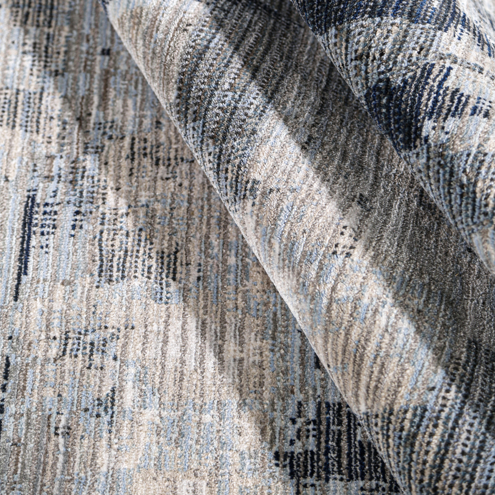Sable Abstract Textured Rug in gray, cream, and blue for modern home decor.