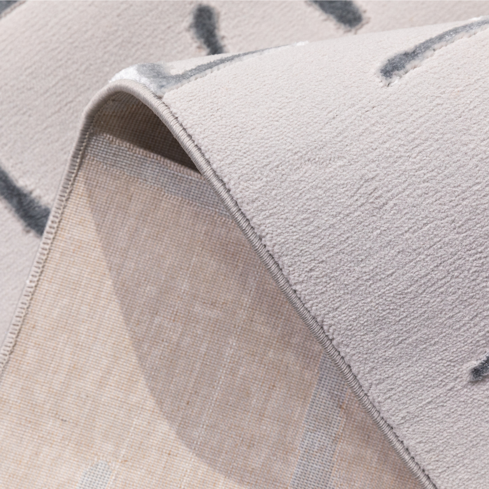 Gideon Strip Textured Rug with soft grey lines design and plush texture.