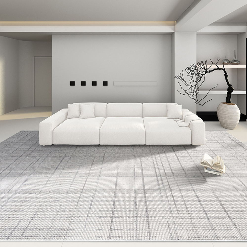 White sofa on textured gray rug in modern living room